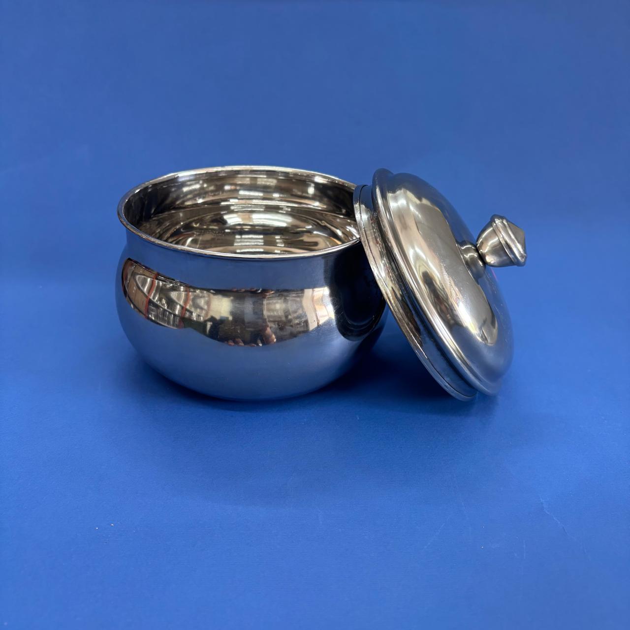 Elegant mango-shaped stainless steel curd pot for storing and serving curd