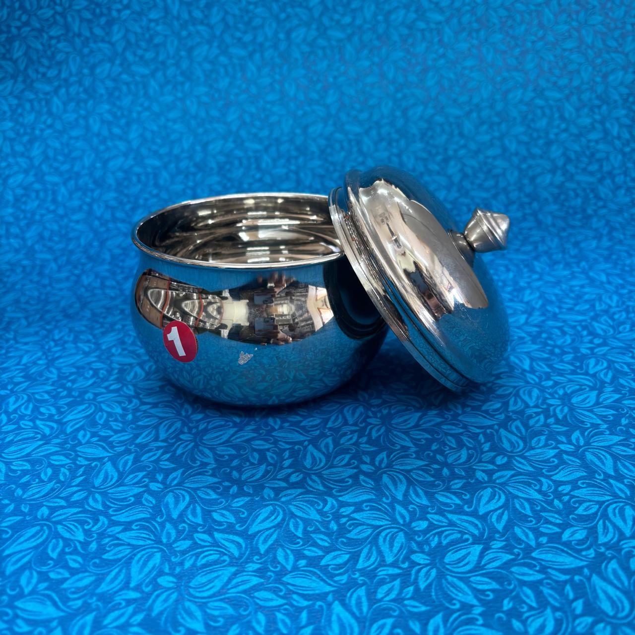 Elegant mango-shaped stainless steel curd pot for storing and serving cur