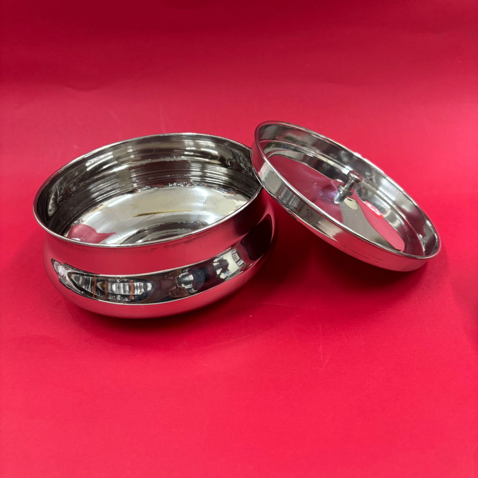 Small stainless steel handi pot for serving curries and gravies at dining table
