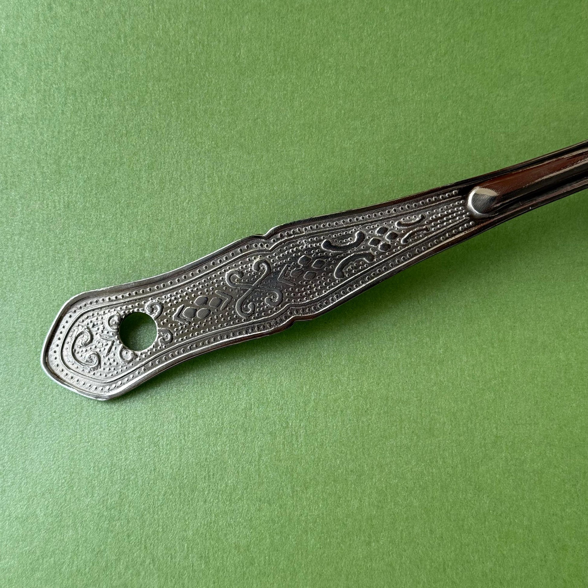 Stainless steel flower ladle with deep flower-shaped bowl and long handle