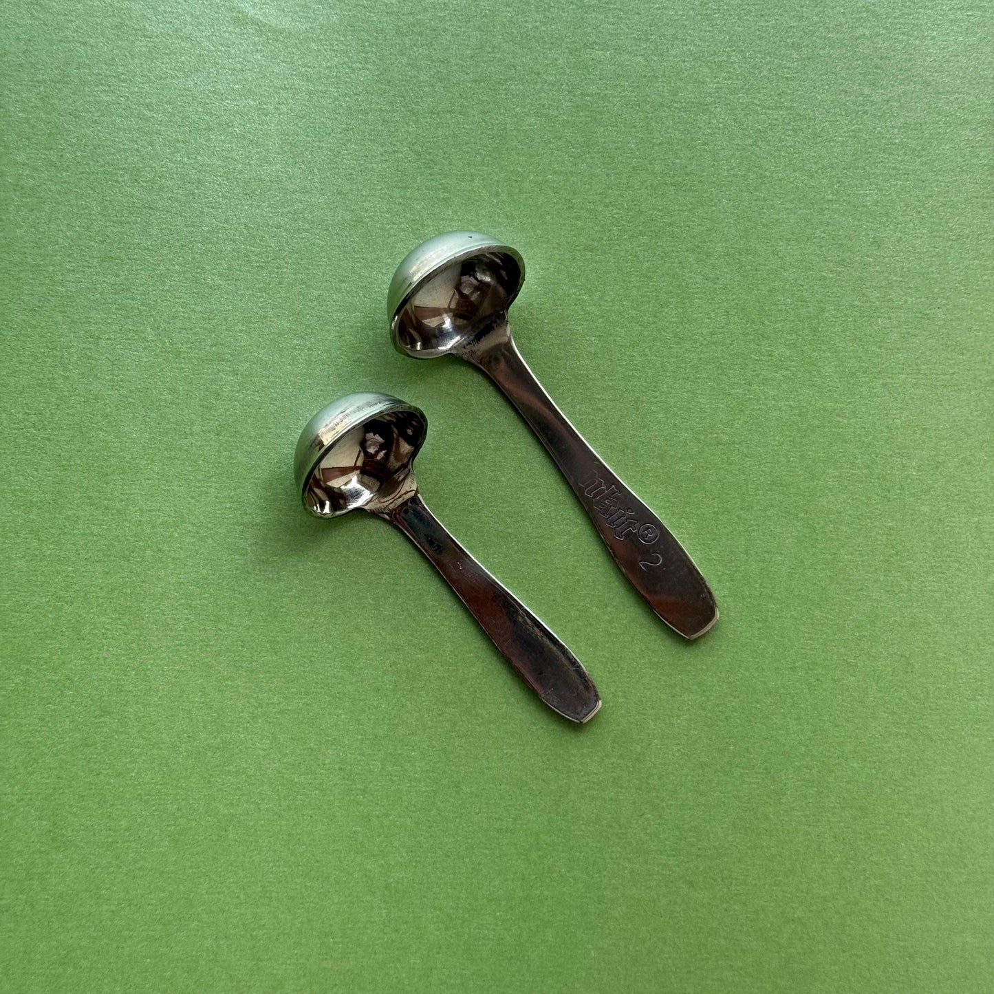 Pair of stainless steel ghee spoons – top view with polished handles