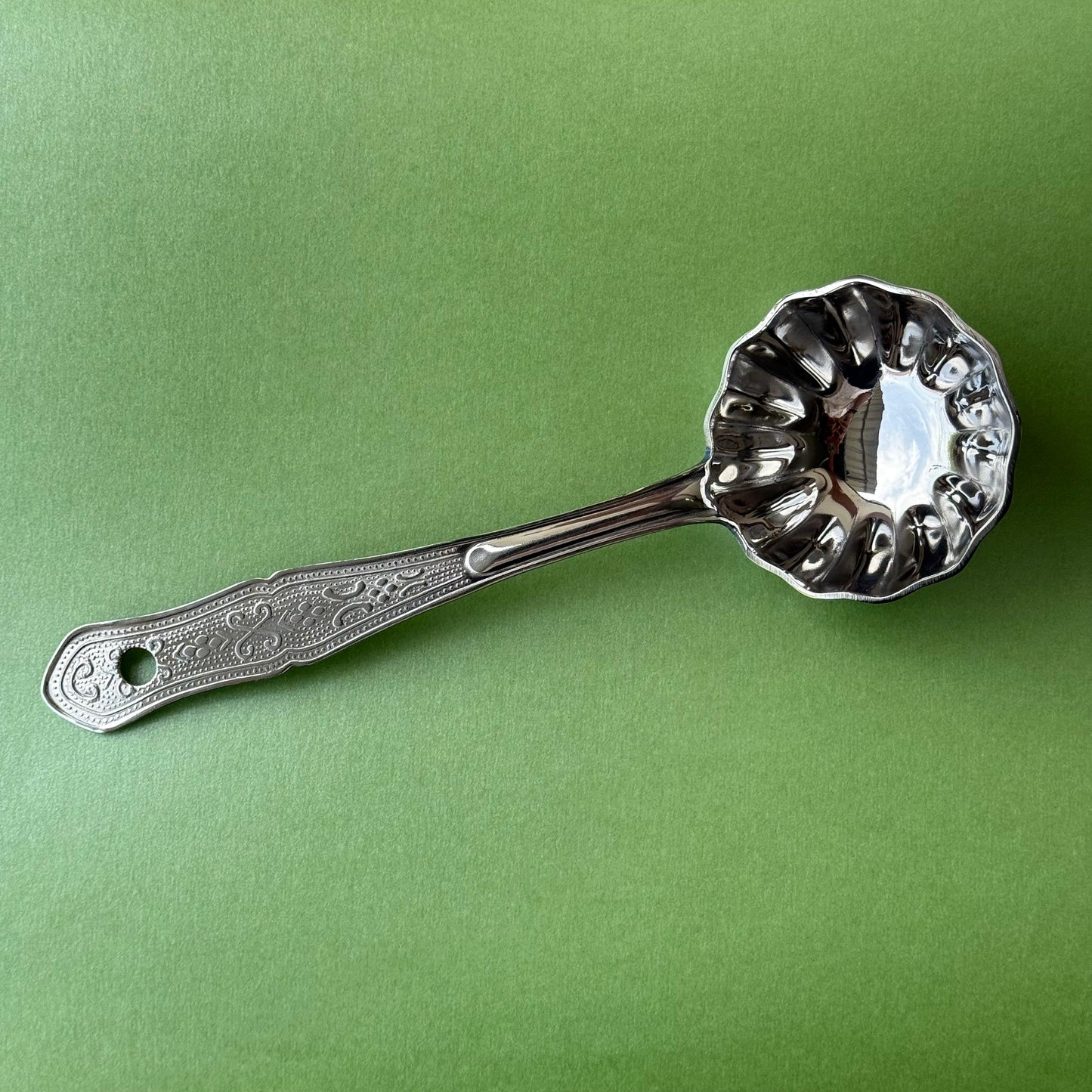 Stainless steel flower ladle with deep flower-shaped bowl and long handle