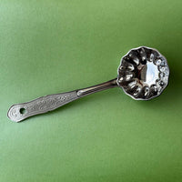 Stainless steel flower ladle with deep flower-shaped bowl and long handle