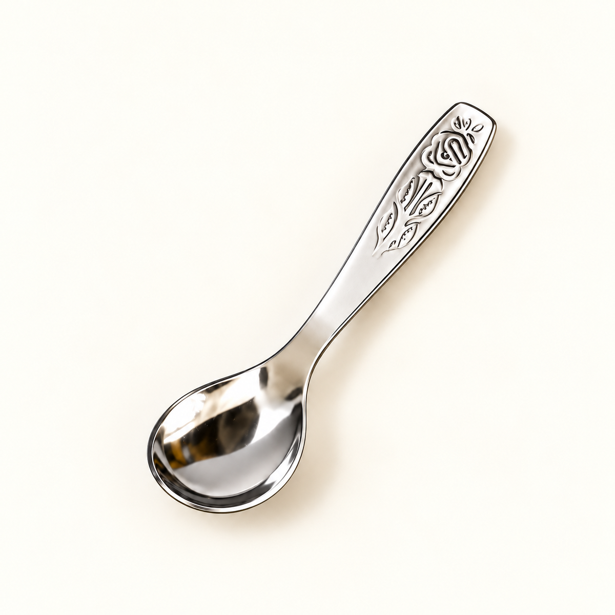 Annam's Masala Spoon in stainless steel – Rose design, single spoon close-up