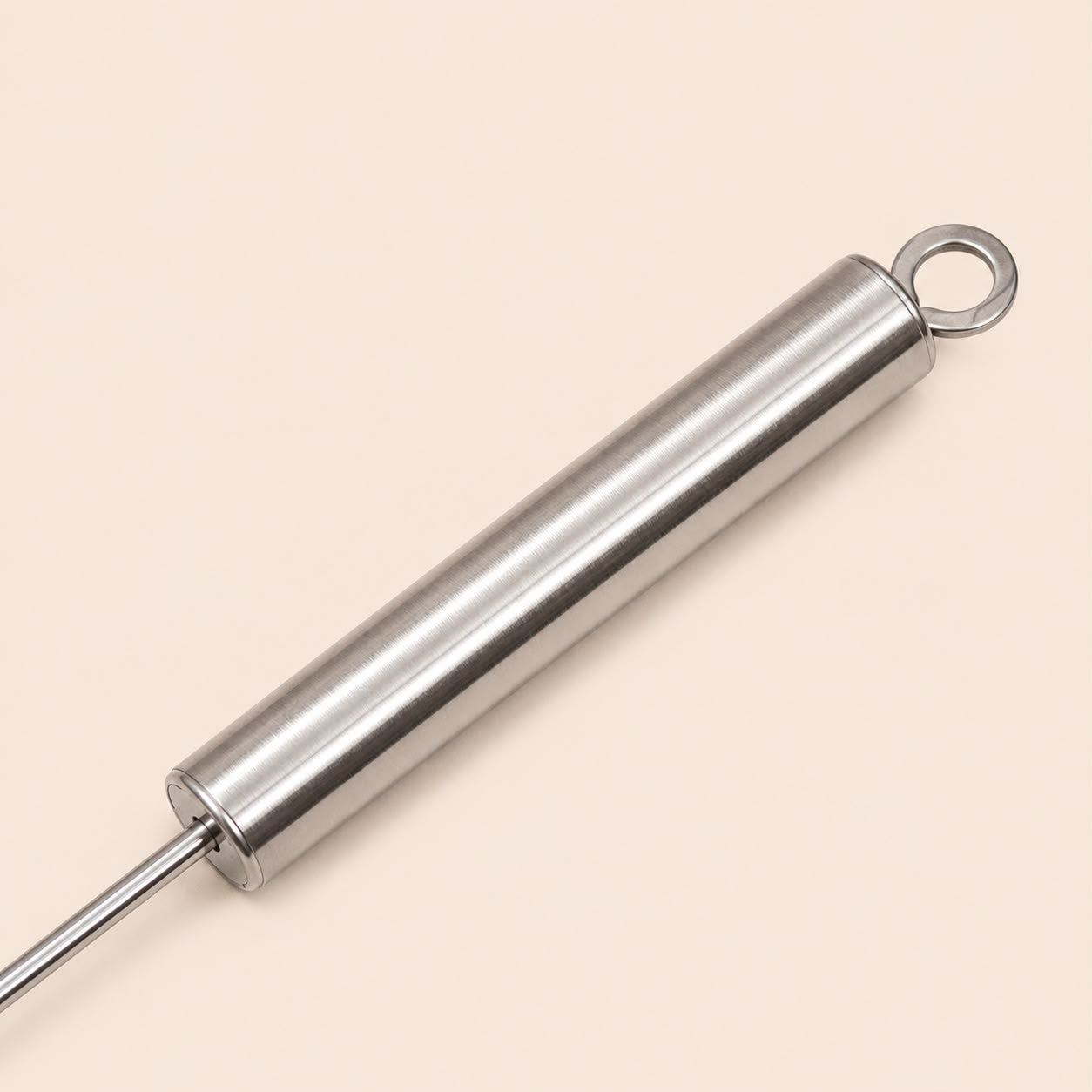 Ergonomic stainless steel handle of the mechanical kitchen whisk.