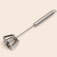 Stainless Steel Mechanical Kitchen Whisk with manual push-action mixer.
